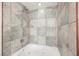 This bathroom features a shower-tub combo with gray tile surround at 6284 Pinewood Ave, Las Vegas, NV 89103