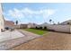 Well-maintained backyard featuring artificial turf, gravel landscaping, and a storage shed at 629 Newbridge Way, North Las Vegas, NV 89032