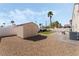 Backyard with a storage shed, gravel landscaping, and artificial turf area at 629 Newbridge Way, North Las Vegas, NV 89032