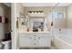 Bright bathroom featuring a double sink vanity, a bathtub, and a neutral color scheme at 629 Newbridge Way, North Las Vegas, NV 89032