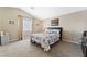 Bedroom with carpet flooring, neutral paint, vaulted ceilings, and comfortable bed at 629 Newbridge Way, North Las Vegas, NV 89032