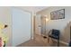 Bedroom featuring a closet with sliding doors, neutral colored walls and carpet, and a comfy chair at 629 Newbridge Way, North Las Vegas, NV 89032