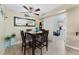 Dining area with a wooden table set, chandelier, and large mirror at 629 Newbridge Way, North Las Vegas, NV 89032