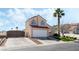Charming two-story home with a well-manicured front yard and a spacious driveway, perfect for suburban living at 629 Newbridge Way, North Las Vegas, NV 89032