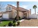 Attractive exterior view, showcasing lush green shrubs and a well-maintained lawn, adding to the home's charm at 629 Newbridge Way, North Las Vegas, NV 89032