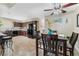 Open concept kitchen and dining area with matching wood cabinets and appliances at 629 Newbridge Way, North Las Vegas, NV 89032