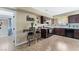 Cozy eat-in kitchen with tile flooring, bar seating, and functional appliances at 629 Newbridge Way, North Las Vegas, NV 89032