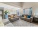 A cozy living room features modern furniture, and natural light creates a serene atmosphere at 629 Newbridge Way, North Las Vegas, NV 89032