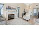 A stylish living room is accented by a fireplace, a cozy chair, and elegant decor at 629 Newbridge Way, North Las Vegas, NV 89032
