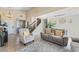 A welcoming living room with tiled floors, soaring ceilings and a neutral palette at 629 Newbridge Way, North Las Vegas, NV 89032