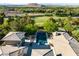 Expansive backyard showcasing a private pool, lush greenery, and golf course views in a serene setting at 66 Golf Estates Dr, Las Vegas, NV 89141