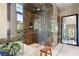 Elegant bathroom with a glass-enclosed shower featuring detailed tile work and a modern design at 66 Golf Estates Dr, Las Vegas, NV 89141