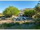 Back exterior view of a luxury home with a pool, patio, and mountain views at 66 Golf Estates Dr, Las Vegas, NV 89141