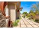 A serene walkway leading to the home's entrance, complemented by unique landscaping at 66 Golf Estates Dr, Las Vegas, NV 89141