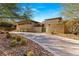 Stunning modern home boasting desert landscaping, hardscape, and clean architectural lines at 66 Golf Estates Dr, Las Vegas, NV 89141