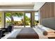Well-lit main bedroom featuring a comfortable seating area and outdoor views at 66 Golf Estates Dr, Las Vegas, NV 89141
