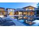 Luxury home displaying a long swimming pool, comfortable lounge chairs, and stylish outdoor living space at 66 Golf Estates Dr, Las Vegas, NV 89141