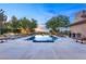 Serene twilight view of an infinity pool with lounge chairs and manicured desert landscaping at 66 Golf Estates Dr, Las Vegas, NV 89141