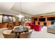 Spacious recreation room with bar, multiple televisions, and comfortable seating arrangements at 66 Golf Estates Dr, Las Vegas, NV 89141