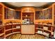 An elegant wine cellar with custom wood racks, ample storage, and a dedicated space for showcasing prized vintages at 66 Golf Estates Dr, Las Vegas, NV 89141