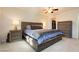 Comfortable bedroom featuring a well-made bed and wooden furniture, perfect for relaxation at 737 Oakmont Ave # 1202, Las Vegas, NV 89109