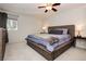 Inviting bedroom with a stylish bed, a window with city views, and neutral decor at 737 Oakmont Ave # 1202, Las Vegas, NV 89109