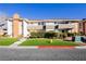 Well-maintained two-story condo building with manicured lawn and greenery at 737 Oakmont Ave # 1202, Las Vegas, NV 89109