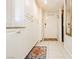 Hallway with ample storage cabinets, updated tile flooring, and closet at 737 Oakmont Ave # 1202, Las Vegas, NV 89109