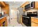 Well-equipped kitchen with stainless steel appliances, a washer, and granite countertops at 737 Oakmont Ave # 1202, Las Vegas, NV 89109