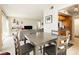 Open-concept living space with dining table seamlessly connected to a modern kitchen at 737 Oakmont Ave # 1202, Las Vegas, NV 89109