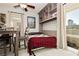 Multi-purpose room featuring a drop-down Murphy bed, shelving, and natural light at 737 Oakmont Ave # 1202, Las Vegas, NV 89109