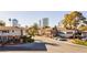 Street view of a well-maintained neighborhood featuring trees, sidewalks, and multiple residential buildings at 737 Oakmont Ave # 1202, Las Vegas, NV 89109