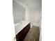 Bathroom featuring a large mirror, single sink, and a combined tub and shower at 7482 Lodano Ave, Las Vegas, NV 89113