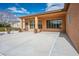 Spacious covered back patio with tan pillars offering ample shade and entertainment area at 7685 Gilespie St, Las Vegas, NV 89123