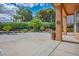 Large covered back patio, perfect for entertaining, with lush landscaping at 7685 Gilespie St, Las Vegas, NV 89123