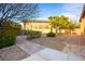 Picturesque backyard featuring a stone pathway and manicured landscaping at 7685 Gilespie St, Las Vegas, NV 89123