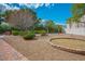 Low maintenance backyard with decorative stone and brick border at 7685 Gilespie St, Las Vegas, NV 89123