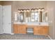A vanity with double sinks and a tiled floor are featured in this bathroom at 7685 Gilespie St, Las Vegas, NV 89123