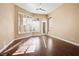 Bright bedroom features wood floors, large windows with modern shutters, and neutral paint at 7685 Gilespie St, Las Vegas, NV 89123