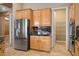 Kitchen showcasing stainless steel appliances, custom cabinets, and pantry access at 7685 Gilespie St, Las Vegas, NV 89123