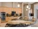 Open kitchen featuring granite counters, stainless steel appliances, and modern pendant lights at 7685 Gilespie St, Las Vegas, NV 89123