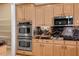 Gourmet kitchen with stainless steel appliances and custom cabinetry at 7685 Gilespie St, Las Vegas, NV 89123
