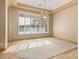 Bright living room featuring large windows with shutters and travertine flooring at 7685 Gilespie St, Las Vegas, NV 89123