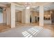 Spacious living room with travertine floors and seamless flow into the kitchen at 7685 Gilespie St, Las Vegas, NV 89123
