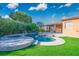 Backyard pool and spa featuring lush landscaping, and ample deck space at 7685 Gilespie St, Las Vegas, NV 89123
