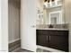 Bathroom featuring granite countertops and dark cabinets at 7833 Mission Point Ln, Las Vegas, NV 89149