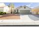 Charming single-story home featuring a well-maintained front yard and a two-car garage at 7833 Mission Point Ln, Las Vegas, NV 89149