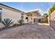 Cozy backyard featuring a covered patio, rock landscaping, and privacy walls perfect for outdoor entertaining at 8406 Belmont Valley St, Las Vegas, NV 89123