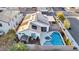 Overhead view of a backyard featuring a swimming pool, spa, shed, and partially covered patio at 8406 Belmont Valley St, Las Vegas, NV 89123