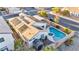 Image of backyard with a swimming pool, hot tub, storage shed, and covered patio at 8406 Belmont Valley St, Las Vegas, NV 89123